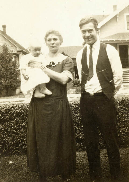 Christina Gabel holding her grandson William John Gabel and standing with her son, William John circa 1924.