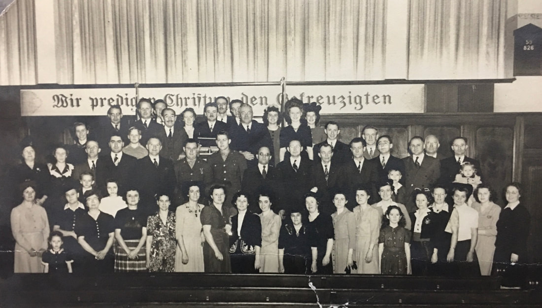 This group photo was taken at the Second German Congregational Church. Rev. Hagelganz is standing in the center of the top row. Source: Terrie Conyers.