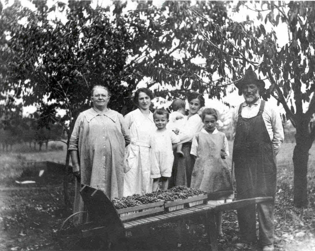 Gettman family with part of their fruit farm harvest.