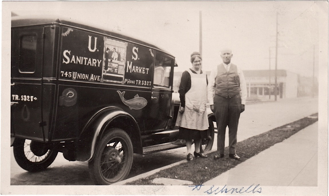Nicolaus and Mathilda Schnell pose with their delivery truck. 